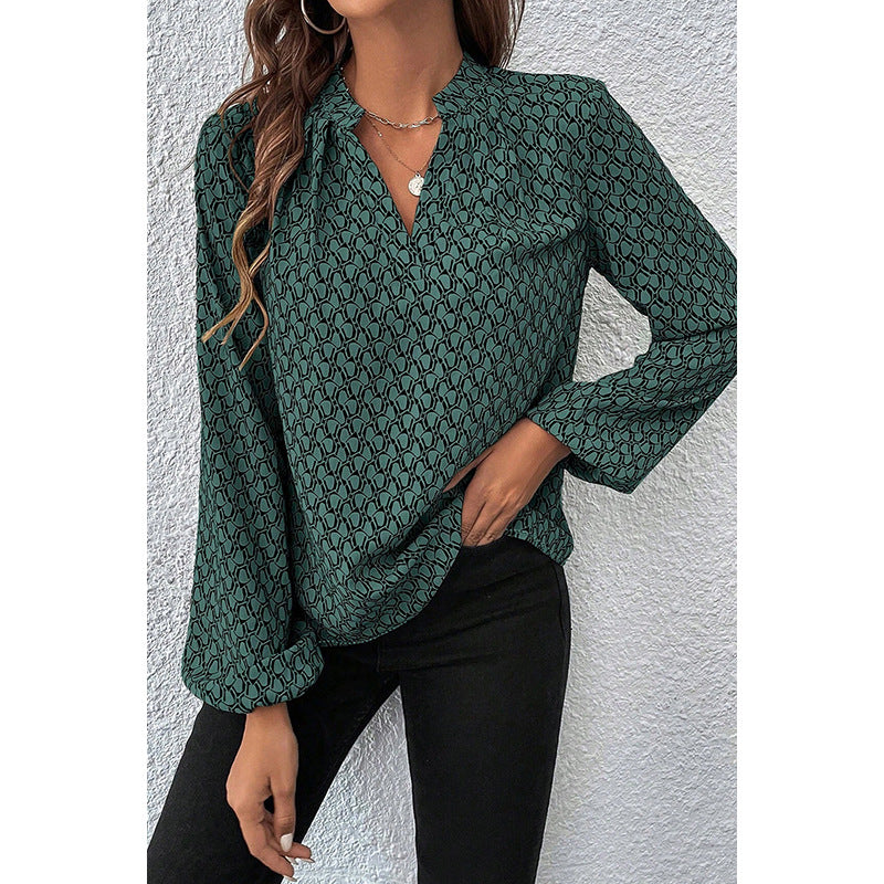 The “GeoVibe” V-Neck Blouse