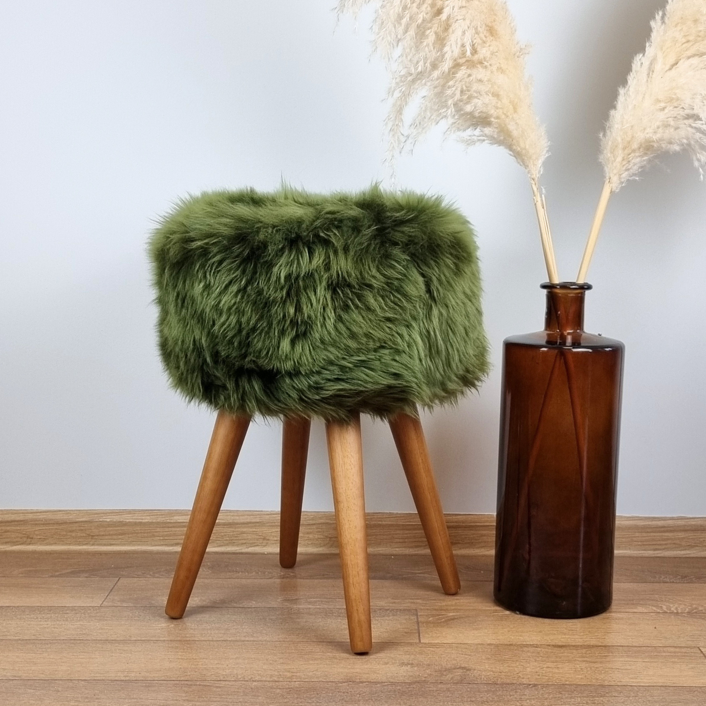 Dark green genuine sheepskin stool with oak legs