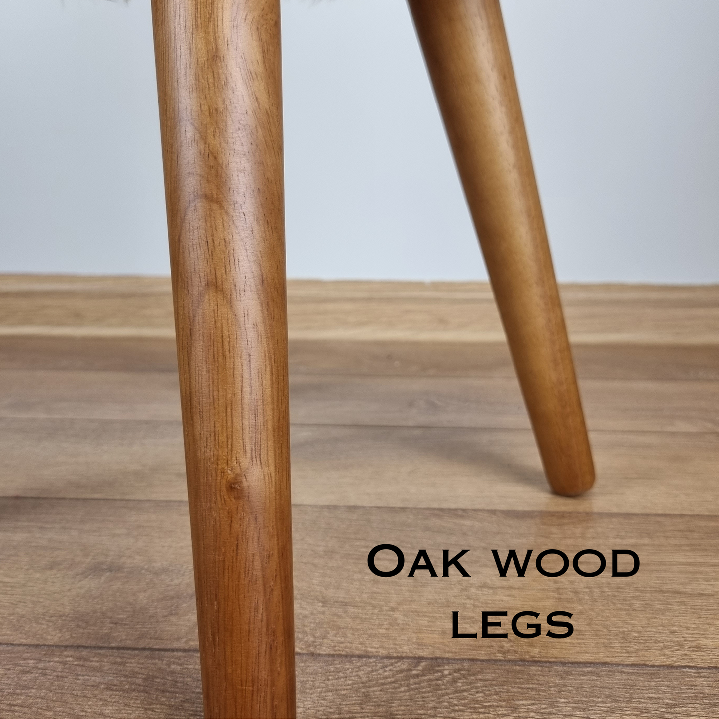 Dark green genuine sheepskin stool with oak legs