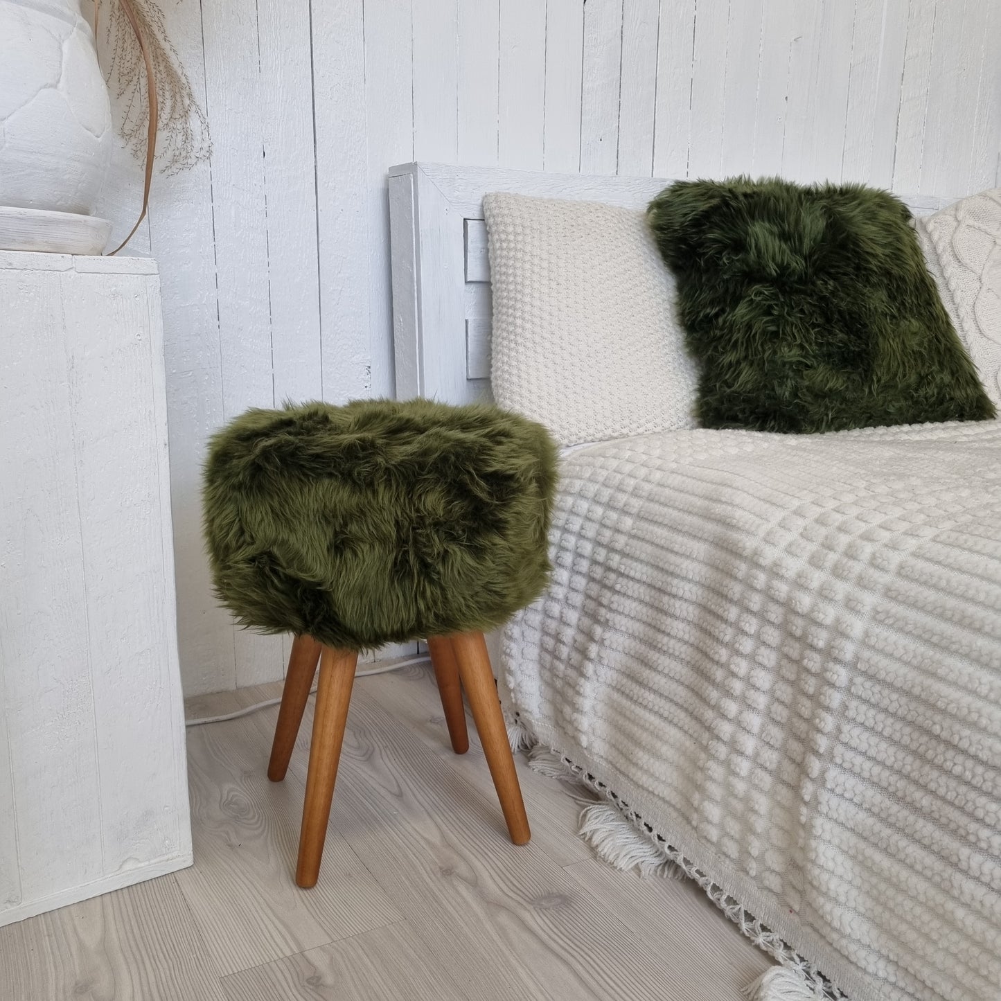 Dark green genuine sheepskin stool with oak legs